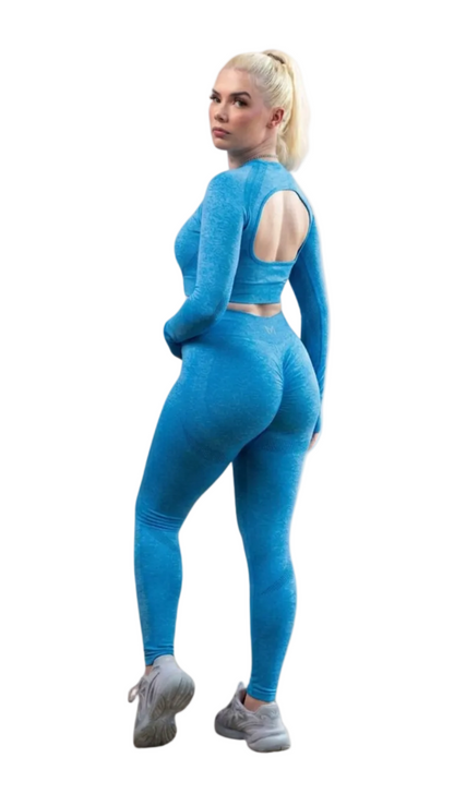 Woman wearing a blue athletic outfit on a white background