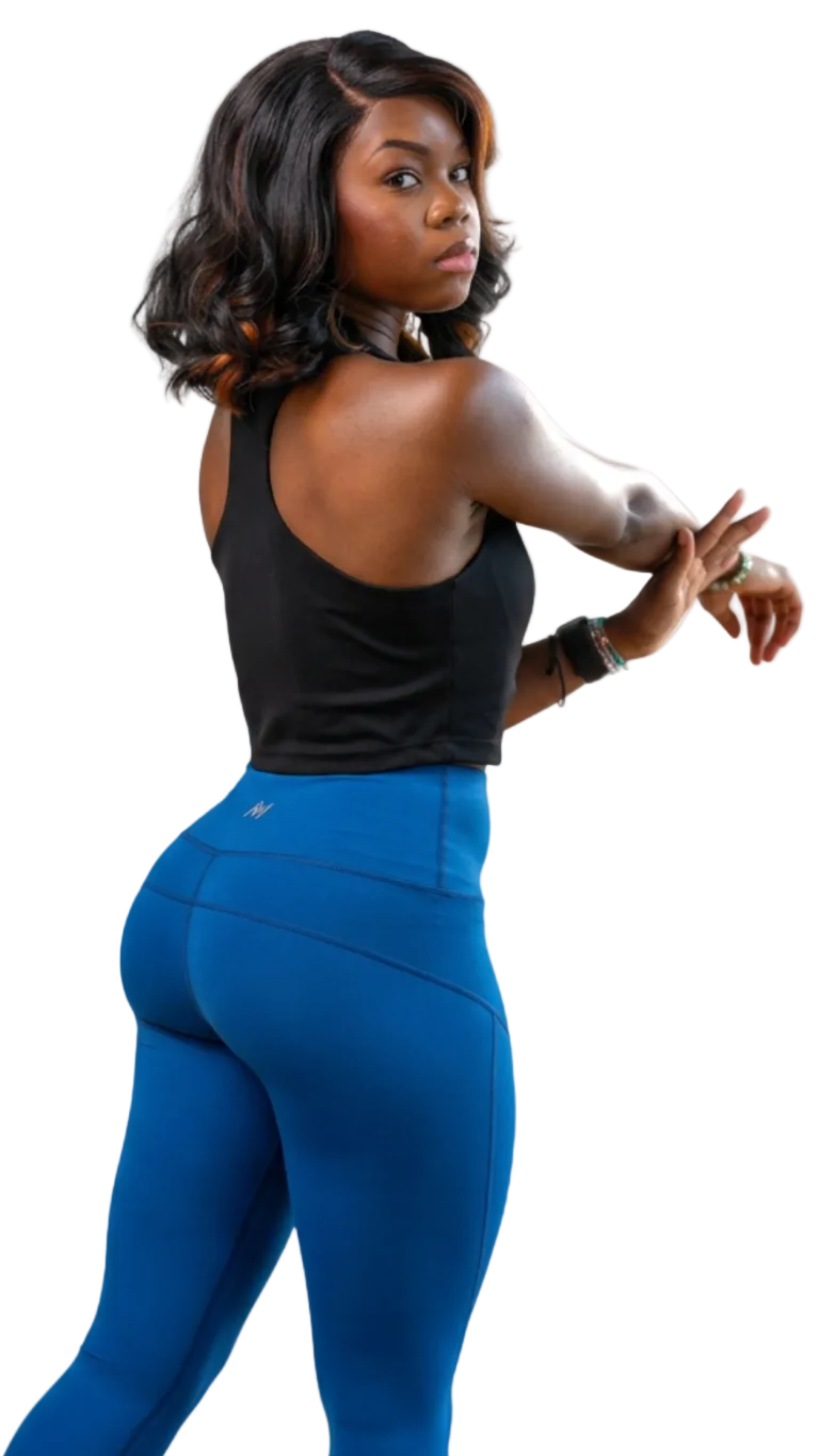 Woman wearing a black tank top and blue leggings on a white background