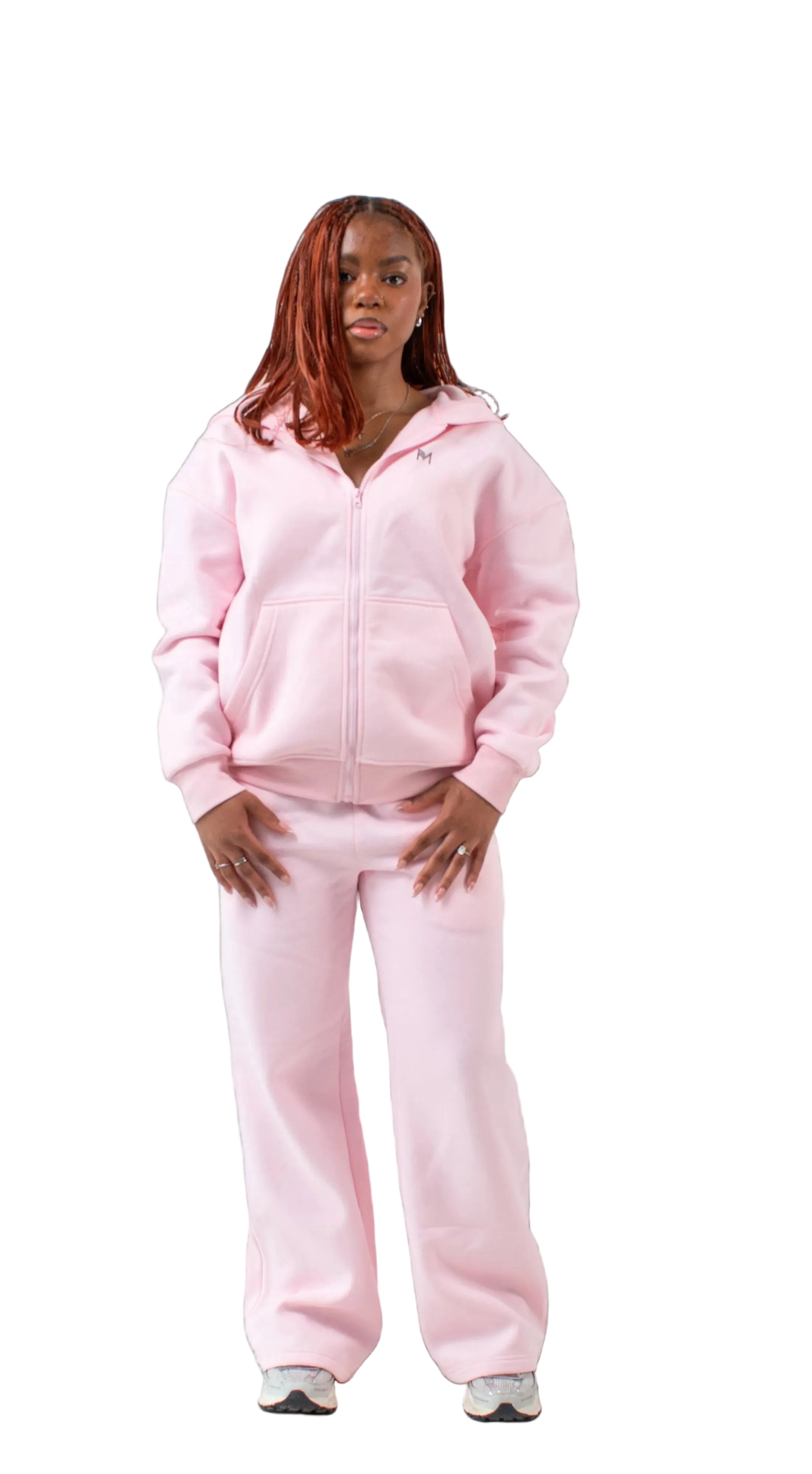 Person wearing a pink tracksuit on a white background