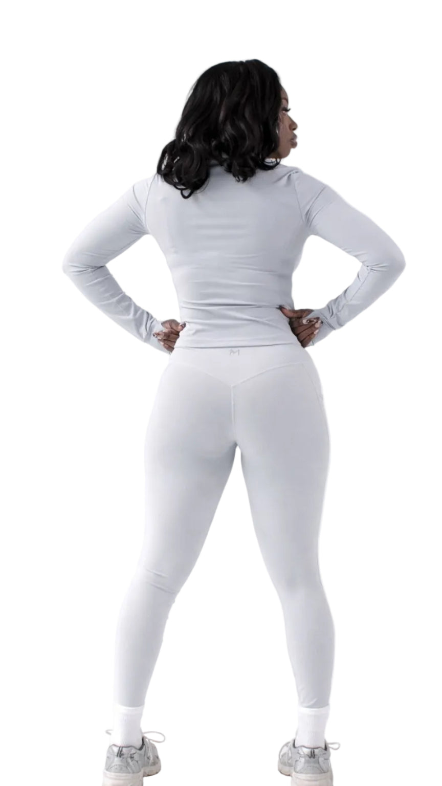 Person wearing a white outfit on a white background