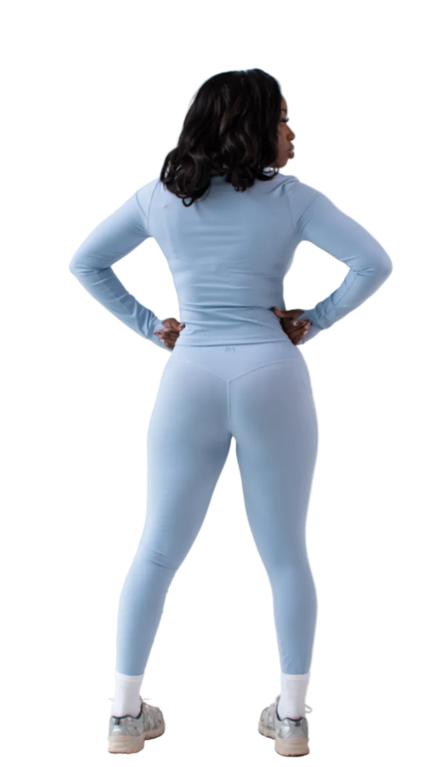 Person wearing a light blue athletic outfit on a white background
